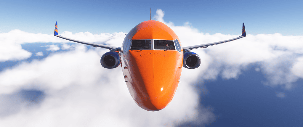Commercial airplane flying above clouds in a flight simulation environment.