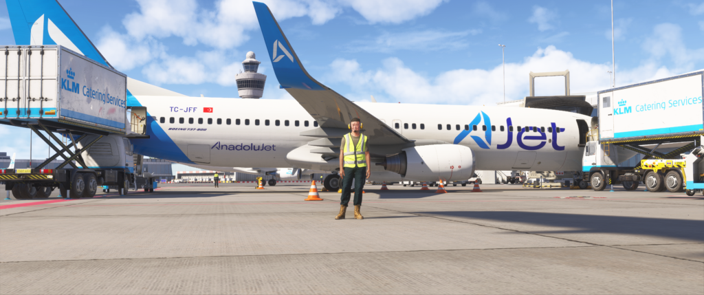 Aircraft boarding at the flight simulation event with a real airplane in the background.